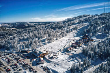 a bird's eye view of a ski lift and cabin