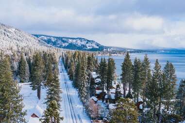 a snow covered lakeside village