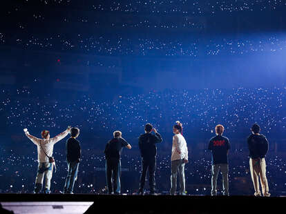 Jungkook performing live on stage at a concert