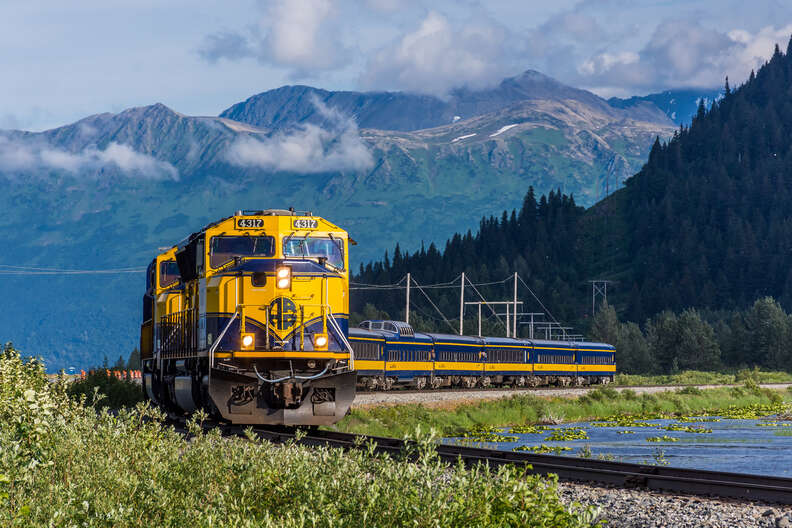 a train running through the mountains