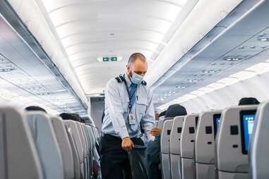 flight attendant and trash bag