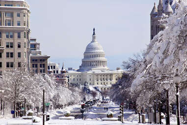  snow covered Pennsylvania Avenue leading up to the us capital building in washington DC
