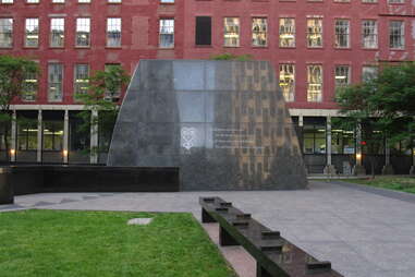 a large stone monument in a city