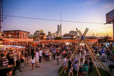 people at an evening arts festival