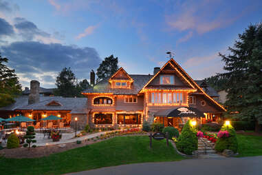 a village hotel lit by fairy lights in the evening