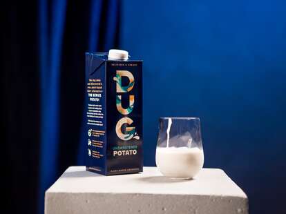 DUG carton and glass of milk