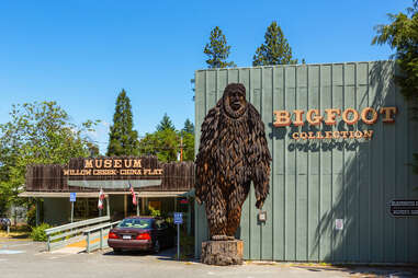 a bigfoot statue outside a small museum