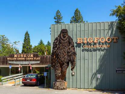 a bigfoot statue outside a small museum