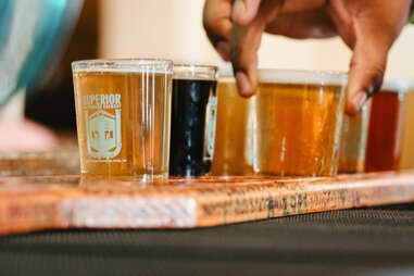 a lineup of beer samples from Superior Bathhouse Brewery