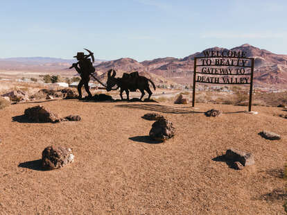 desert sign reading "welcome to beatty gateway to death valley" 