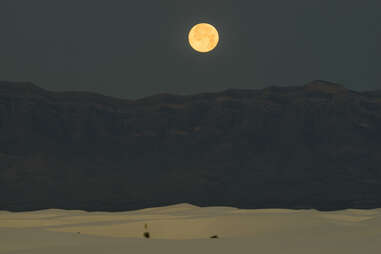 moon over desert and mountains