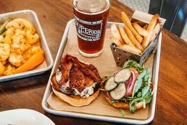 a meal of burger fries and beer