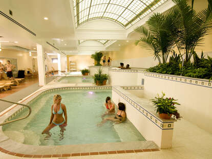 people soaking in a hot spring