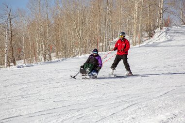 Adaptive sports bi-skiing