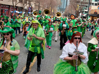 A band dressed in eclectic green costumes plays while marching in the St. Patrick's parade down Peachtree Street, on March 15, 2014 in Atlanta, GA