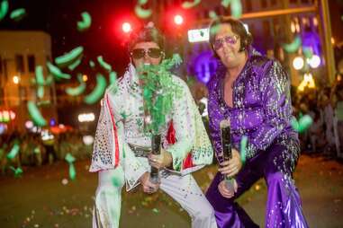 two elvis impersonators at a St. Patrick's Day Parade