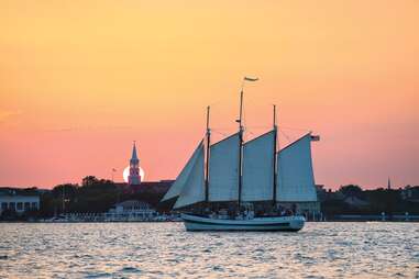a sailboat at sunset