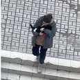 Woman In Ukraine Seen Comforting A Cat While Air Raid Sirens Sound