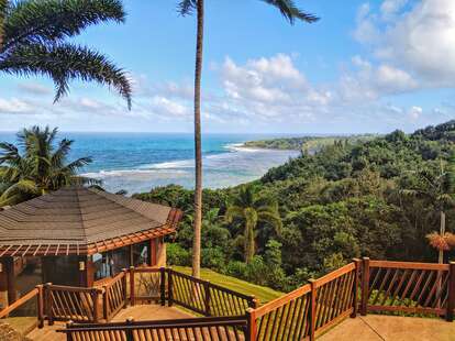 a tropical cabana overlooking the ocean