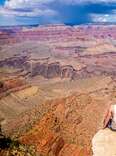 person on the edge of the grand canyon