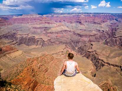 person on the edge of the grand canyon