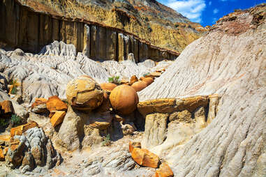 unusual, circle shaped rocks on the side of a mountain