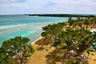 a rugged island by a crystalline sea