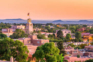 the skyline and mountains of santa fe, new mexico at dusk