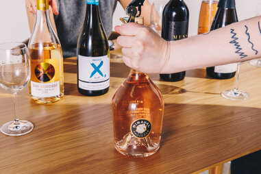 opening miraval wine bottle