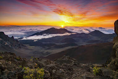 sunrise over the lush mountains of Haleakalā National Park in Hawaii