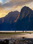 People in the beach at the Milford Sound, New Zealand.