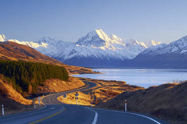 A road leading to Mount Cook Village, with Mount Cook in the background. 