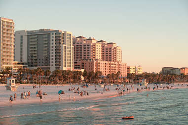 hotels along a busy shoreline at sunset