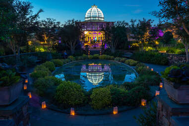 a botanical garden and conservatory at night