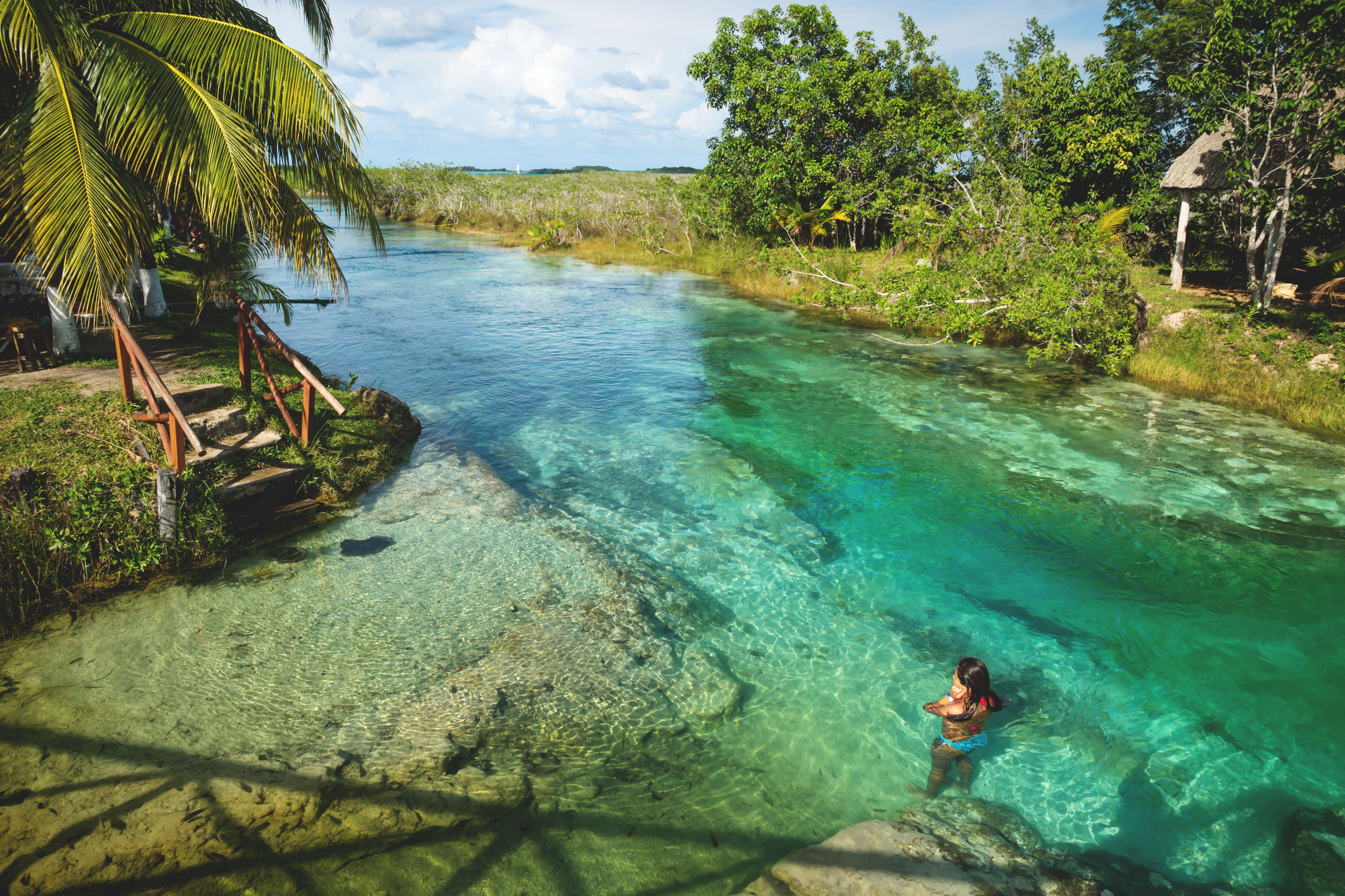 a woman swimming in a lagoon