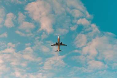 plane flying among clouds