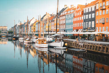 Colourful townhouses facades and old ships along the Nyhavn Canal, Copenhagen