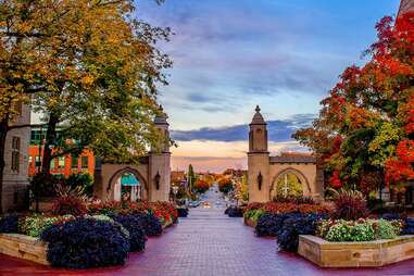 pathway leading past trees and archways