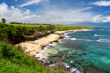 people on a beautiful sweeping beach