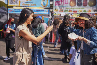 lisa ling taking pictures at night market
