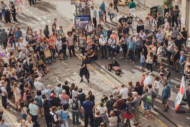 street performer surrounded by spectators in Edinburgh