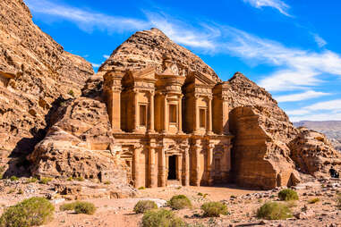 The stunning view of Ad Deir, the Monastery of Petra, Jordan on a clean blue sky winter day