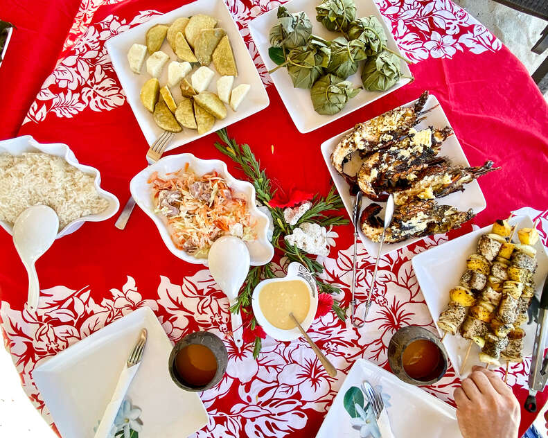 Food spread on a red blanket