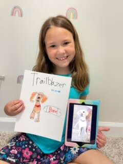 girl draws picture of adoptable dog