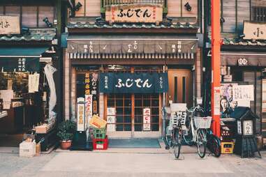 A bike leans outside a building in Tokyo