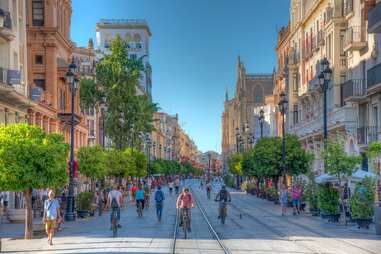 People strolling on a street in Seville