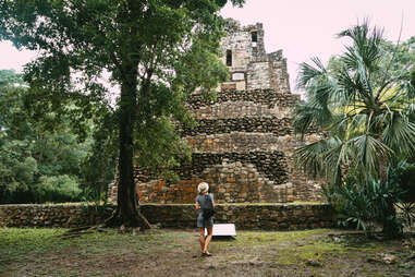 Escape the Touristy Traps with These Adventures in Tulum - Thrillist 6 Tourist near the ancient Mayan pyramid in Quintana Roo