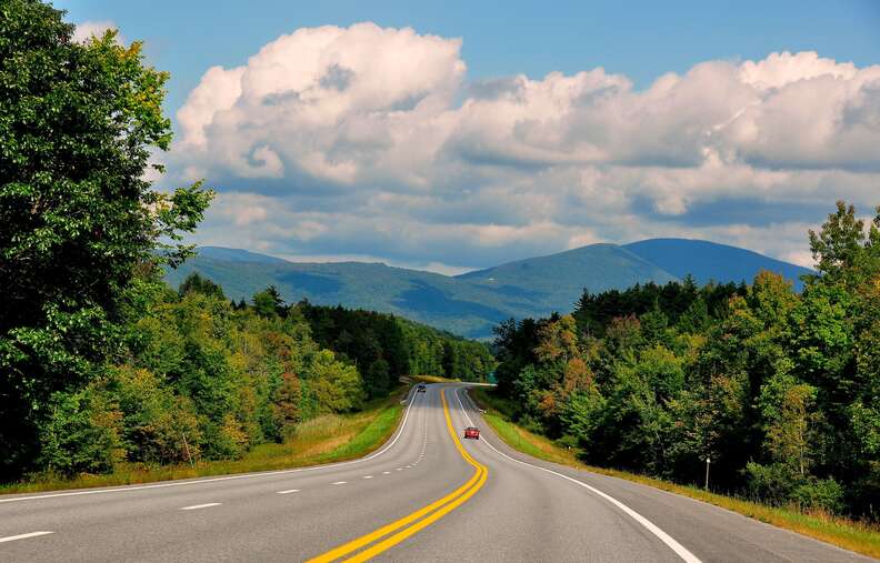 road leading between mountains