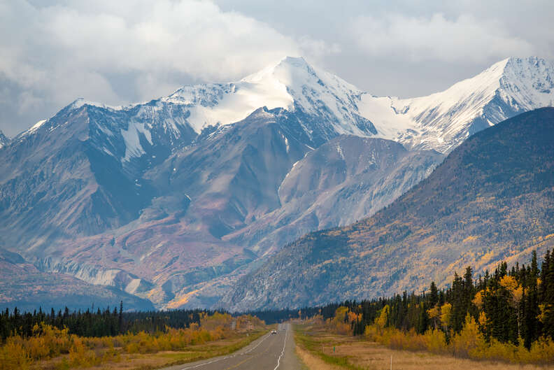 highway leading to an enormous mountain