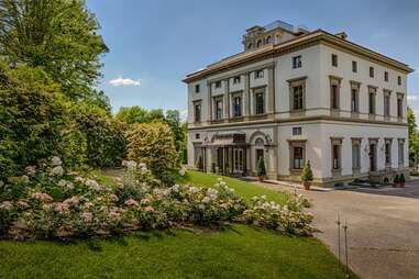 Large house surrounded by grass